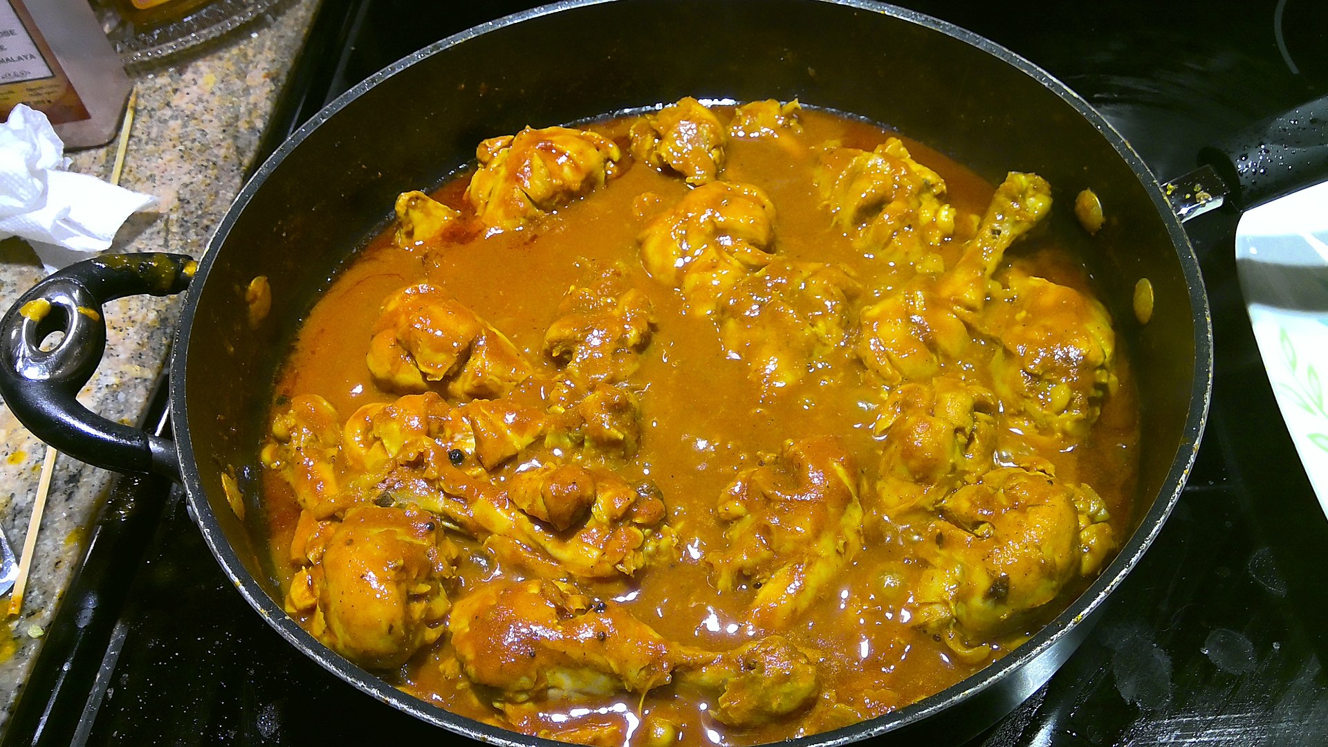 Chicken curry in iron pot