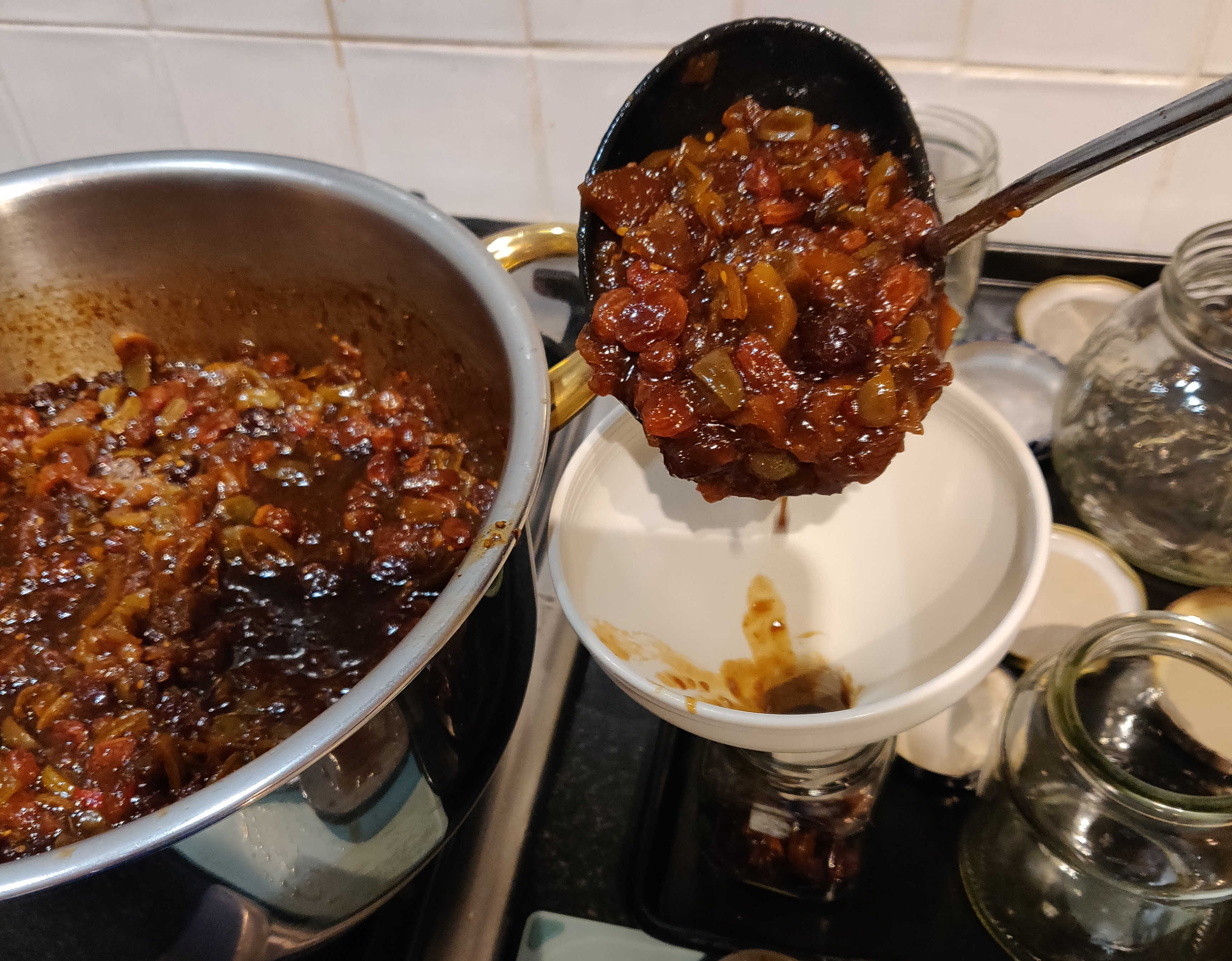 Finished chutney being filled into jars